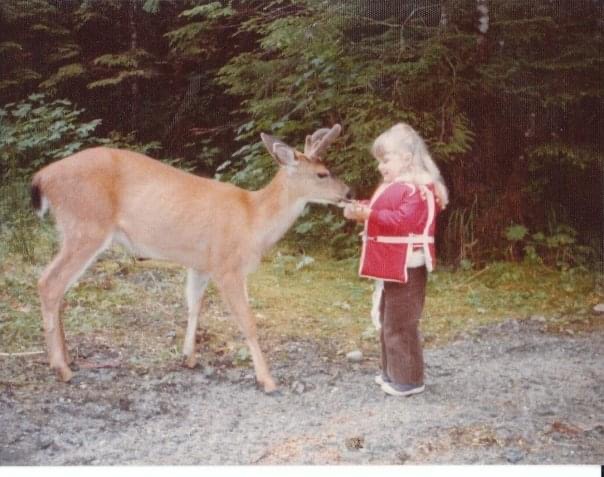 Young Valorie with a deer